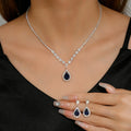 Parures de bijoux élégantes pour femme, style « goutte d’eau », avec cristaux roses (collier et boucles d’oreilles) – Idéal pour un mariage ou une cérémonie.